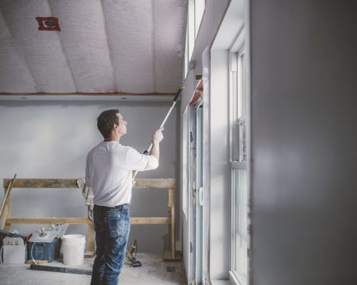 painter-decorator-working-inside-building-2024-06-28-20-45-15-utc